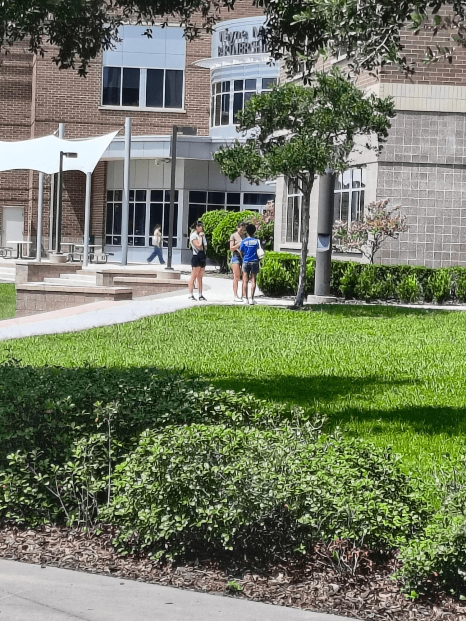 Students walking together outside a campus building