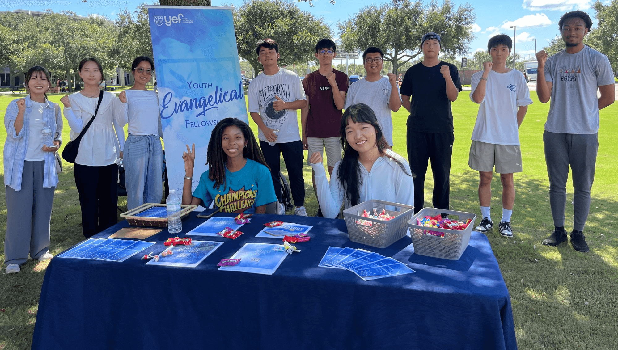 YEF students at an outreach table on campus