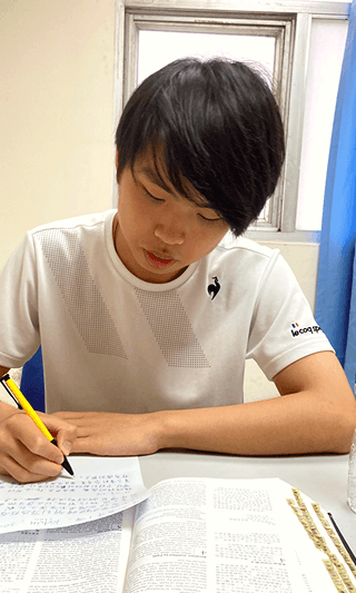 A student studying the Bible